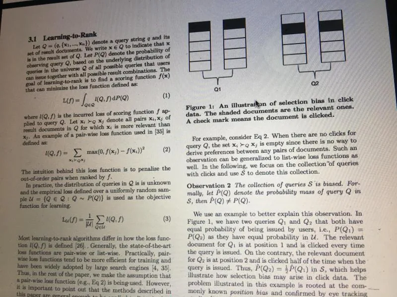 Photo of research paper page with learning-to-rank equations and figure