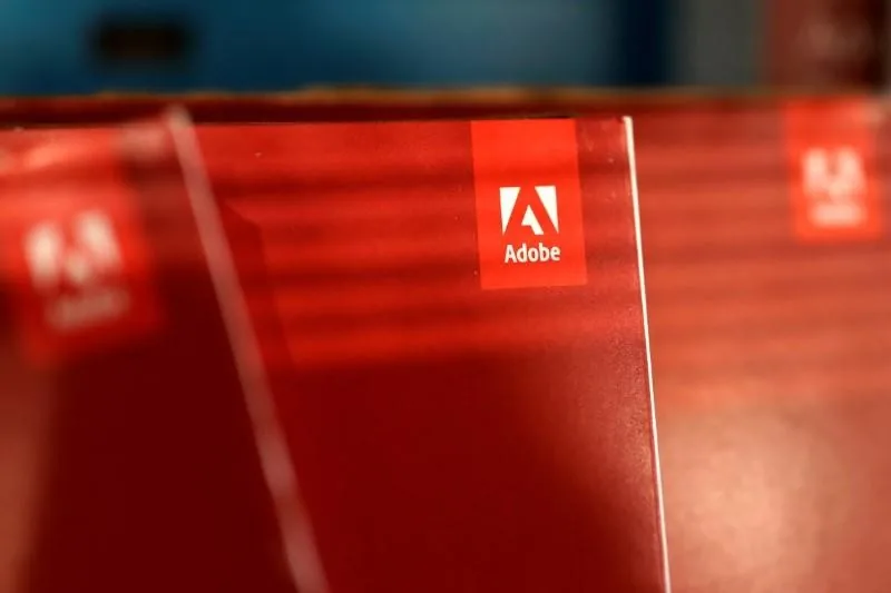 Adobe logo on red glass panel