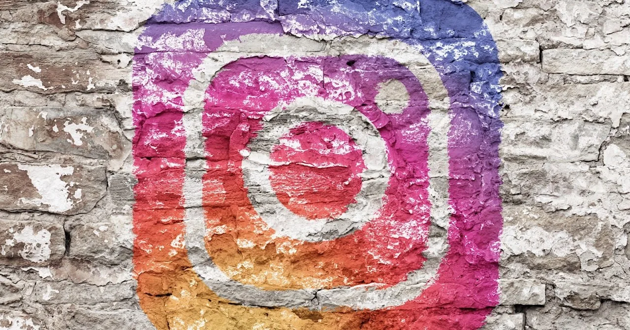 Instagram logo painted on a brick wall