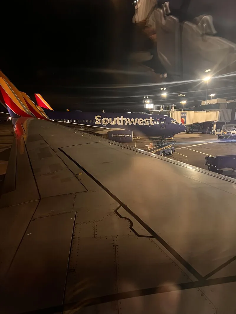 Airplane wing at night on a Southwest flight
