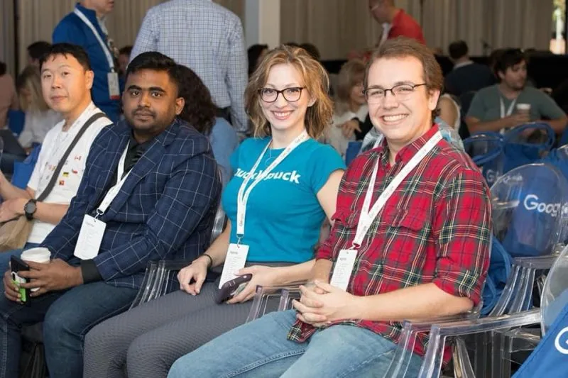 Attendees seated in a row at a conference (repost of 0044)