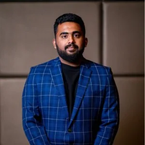 Venkata's portrait in blue checked blazer (newsletter series logo)