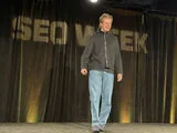 Low-res photo of speaker on SEO Week stage