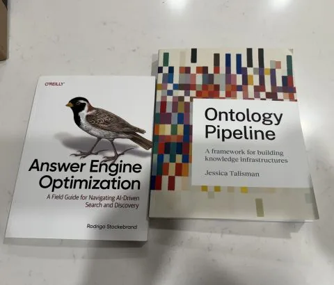 Photo of "Answer Engine Optimization" and "Ontology Pipeline" books