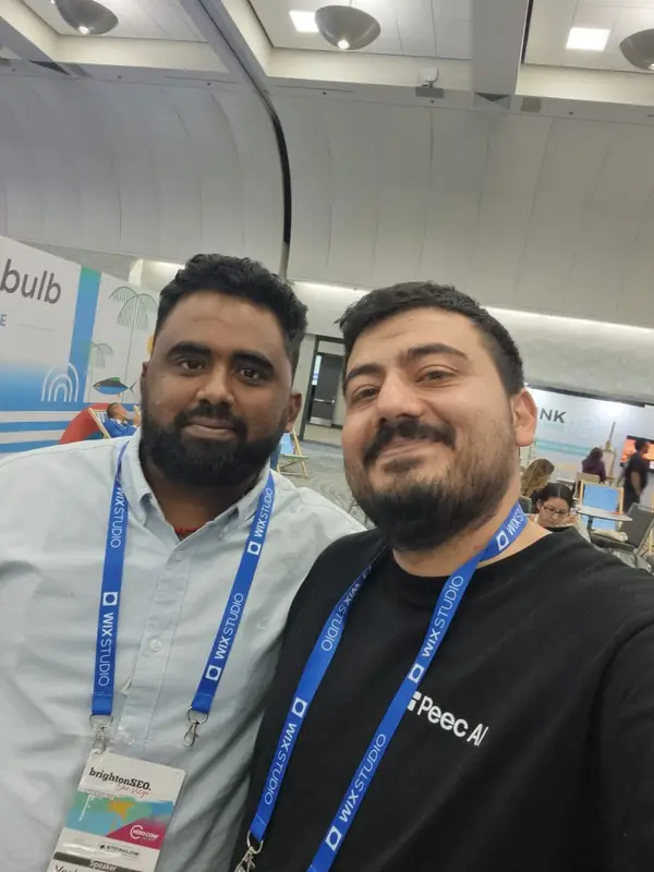 Selfie of Venkata Pagadala, wearing his brightonSEO San Diego speaker badge, with a fellow attendee in the expo hall